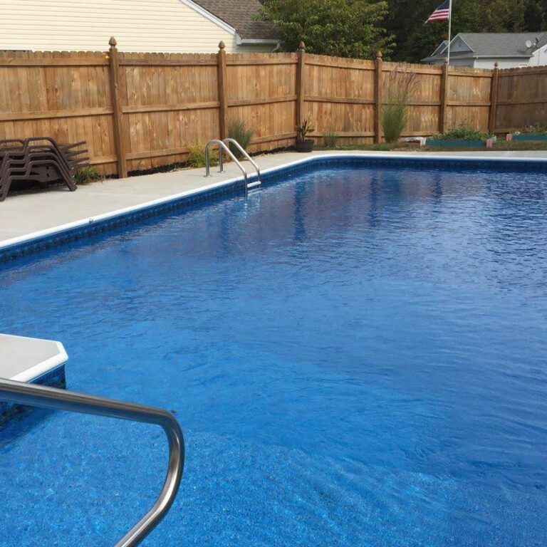 Plunge pool with wooden fence around it