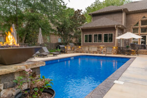 Fiberglass backyard pool design by Greenscapes Outdoor Living in Madison, AL