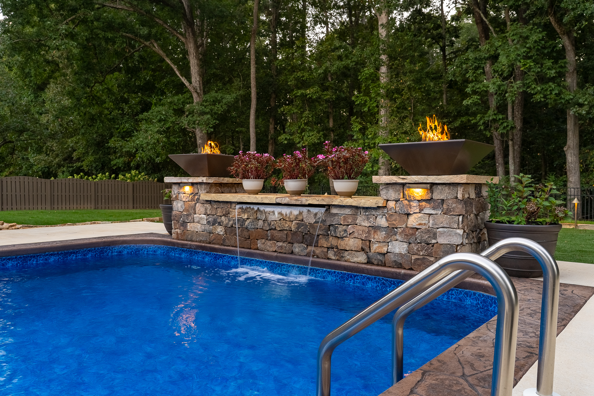 Waterfall pool design by Greenscapes Outdoor Living in Madison, AL